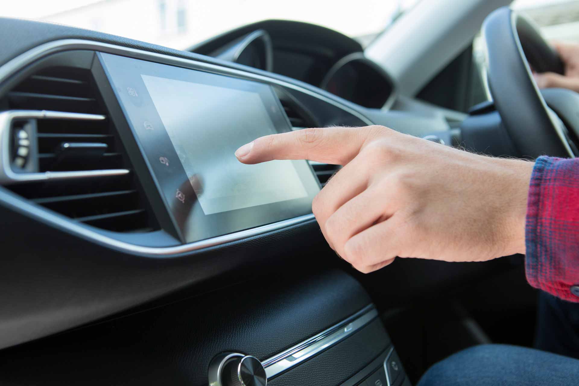 Driver using an in-dash entertainment center with touchscreen