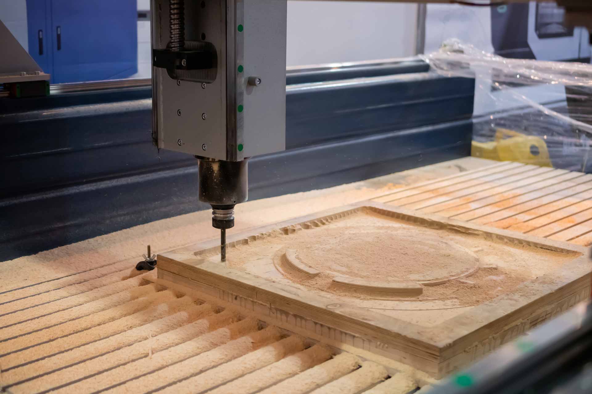 CNC machine milling a piece of wood
